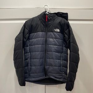 Mens The North Face black and grey lightweight puffer jacket with hood.
